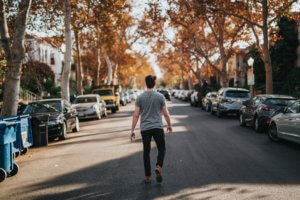 a man walking along a city street