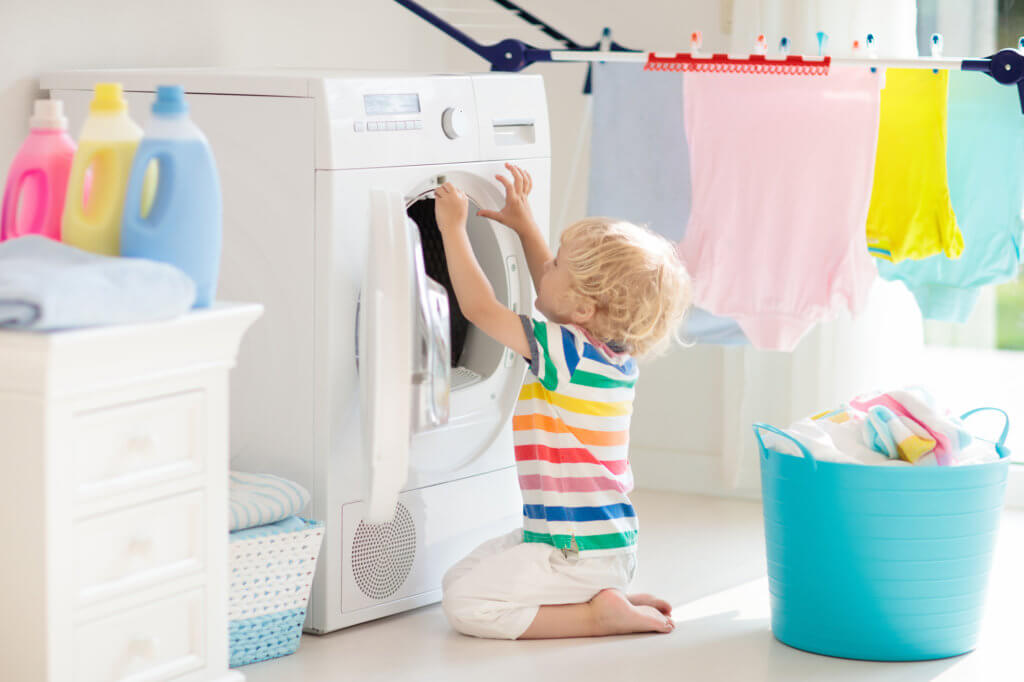 child helping with laundry