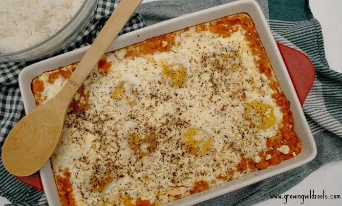 red lentil egg bake in a baking dish with wooden spoon.